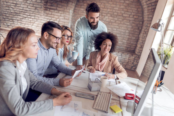 istock Business coworkers discussing new ideas in modern office 928951952