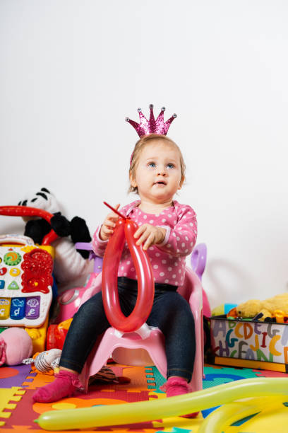 istock Cheerful and playful baby with crown 928957578