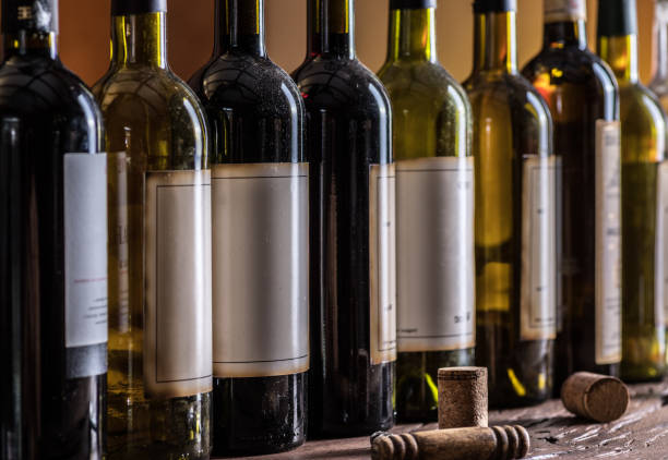 istock Line of wine bottles. Close-up. 928958132
