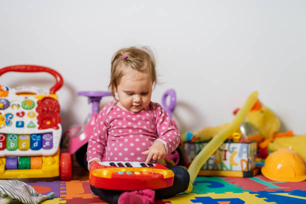 istock Cheerful and playful baby playing music 928961602