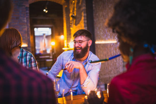 Friends celebrating birthday in the pub
