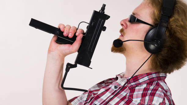 istock Gamer man shooting from gun 928969396