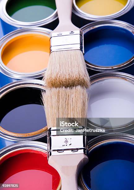 Different Color Cans Of Paint And Brushes On Swatches Background Stock  Photo - Download Image Now - iStock
