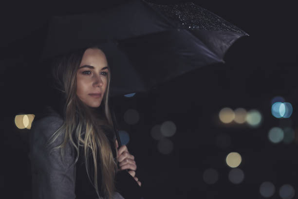 istock Beautiful woman in rainy night 928978308