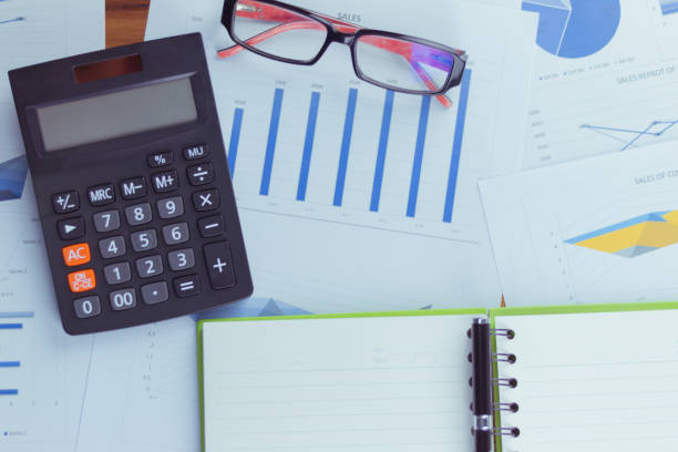 istock Top view of the businessman's work, calculator placed on the table. 928992046