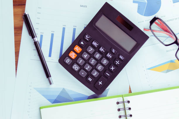 istock Top view of the businessman's work, calculator placed on the table. 928992052