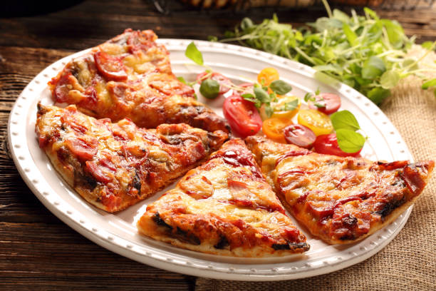 istock Homemade pizza on a white plate 928999234