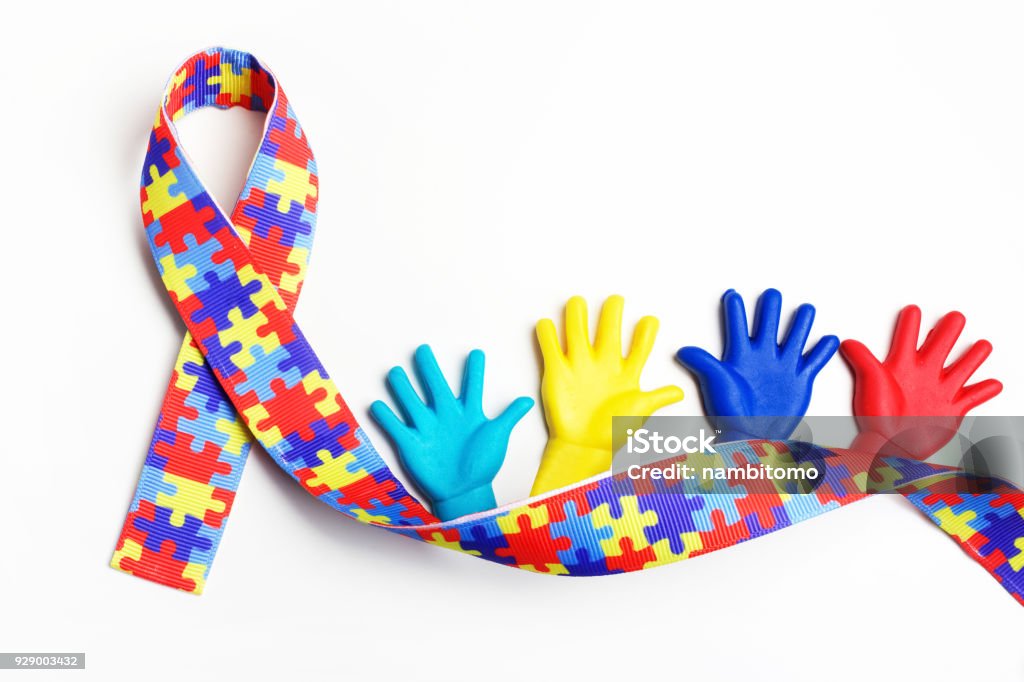 Autism awareness concept with colorful hands on white background. Top view Autism awareness concept with colorful hands on white background. Autism Stock Photo