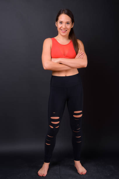 istock Young beautiful multi-ethnic woman ready for gym against black background 929008188