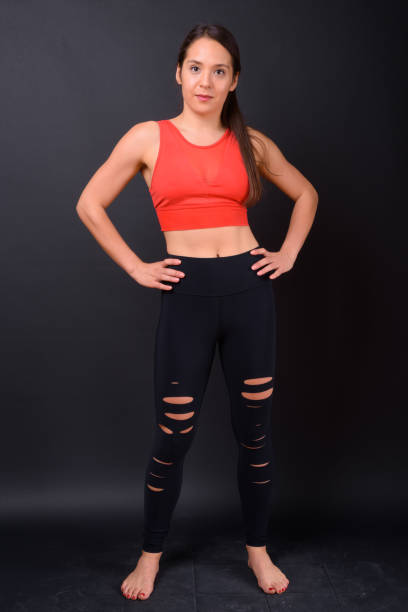 istock Young beautiful multi-ethnic woman ready for gym against black background 929008192