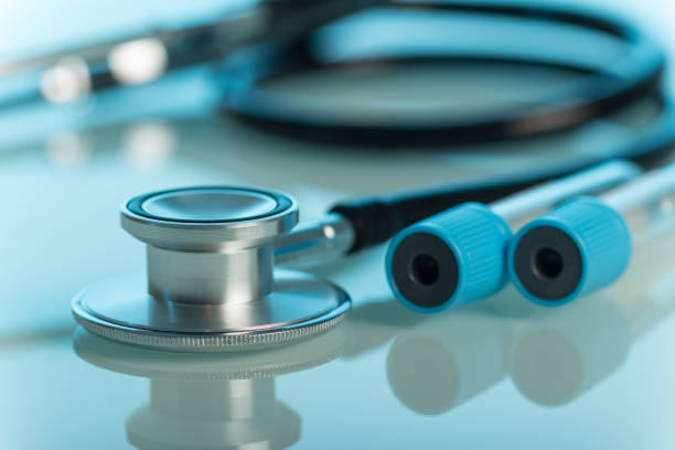 istock Phonendoscope and sterile tubes for diagnostic purposes, on light blue 929009016