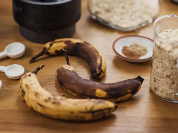 Vegan banana bread and ingredients with over ripe bananas