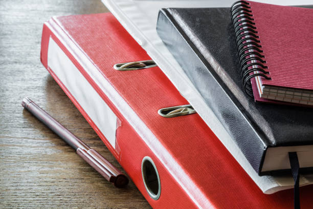 istock Office supplies on a brown wooden work desk. Workday. Checking financial documents. Accounting concept. 929009988