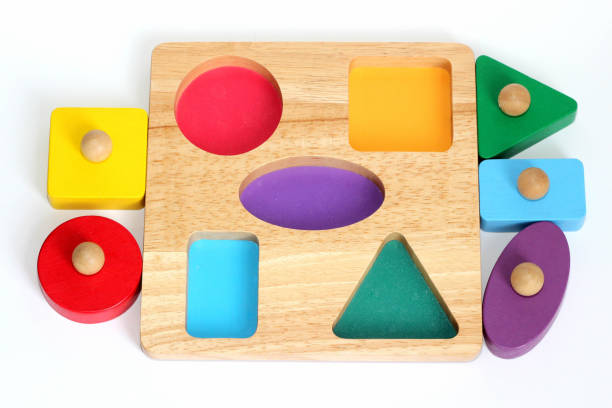 istock A child's shape sorter jigsaw puzzle - colorful 929015982