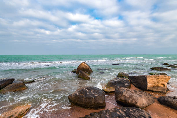 istock Seashore with rocks and clear turquoise water 929016086