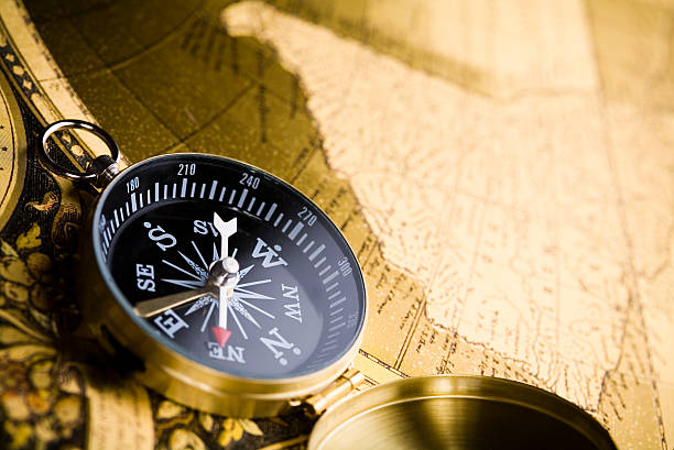 istock Close up view of the compass on map 92901616