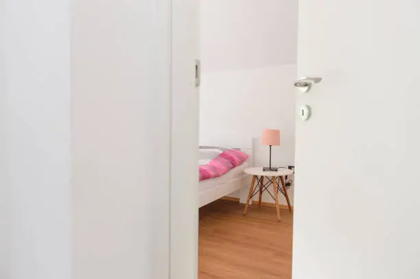 Photo of Half-open door of a bedroom