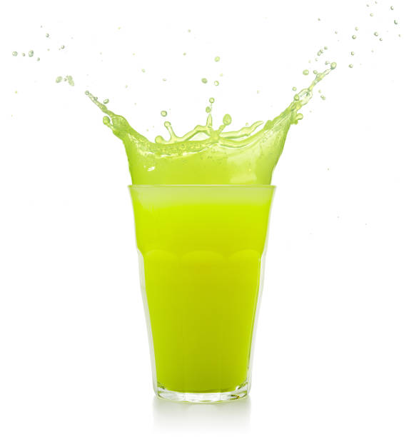 green juice glass splashing stock photo
