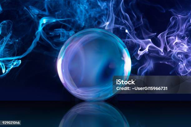 Crystal Ball In Smoky Background Stock Photo - Download Image Now - Sphere, Sports Ball, Magician