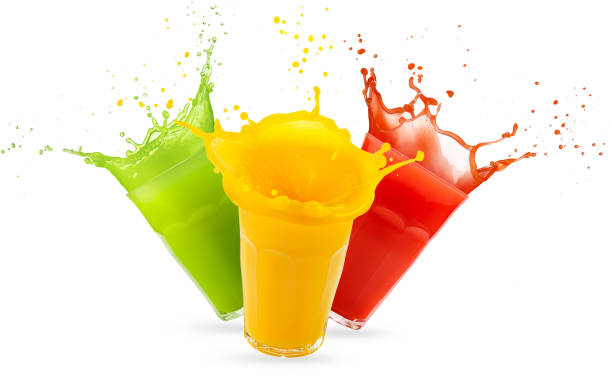 three glasses of juices splashing on white