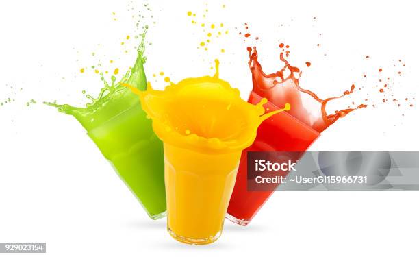 Three Glasses Of Juices Splashing On White Stock Photo - Download Image Now - Juice - Drink, Splashing, Spray