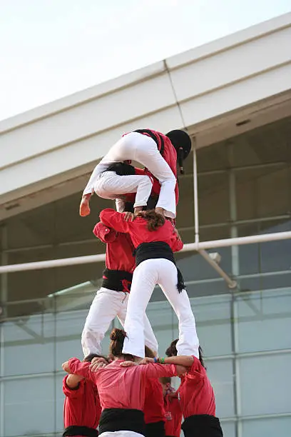 Traditional fiesta display of human towers, sometimes 8 tiers high with the smallest climbing to the top