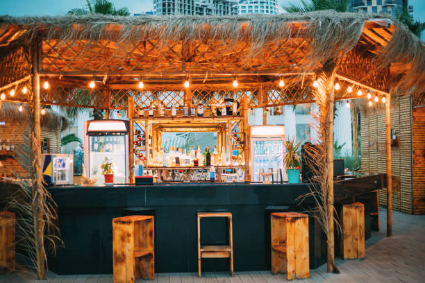Evening Bar In Form Of Tropics On Sea Coast Evening Bar In Form Of Tropics On Sea Coast. beach bar stock pictures, royalty-free photos & images