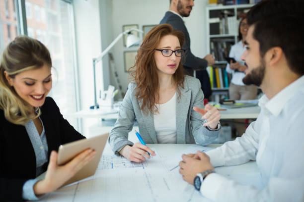 istock Happy business colleagues in modern office 929036800