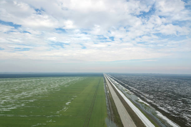 istock Grain field covered by snow in spring Aerial View. 929036872