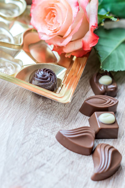 istock sweets and roses on wooden table for gift 929038398