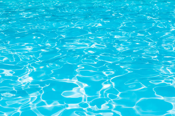istock Blue water surface in swimmjng pool for background 929043770