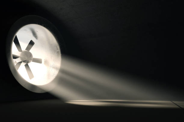 3d rendering of ventilation system with light rays in concrete garage
