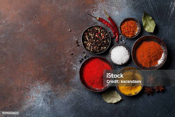 Colorful Spices On Stone Table Stock Photo - Download Image Now - Spice, Culture of India, Backgrounds