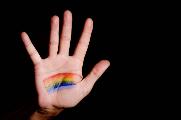 istock man with a rainbow flag in his hand 929050784