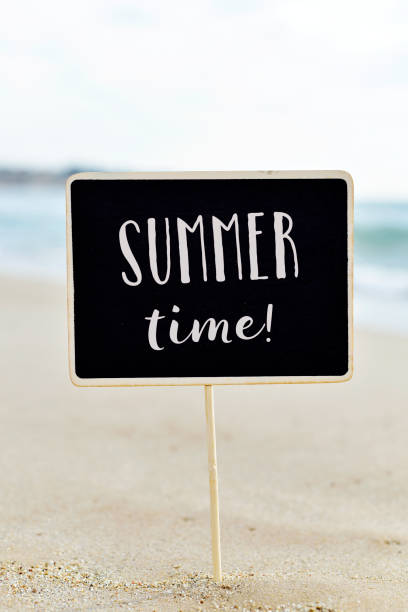 istock text summer time in a signboard on the beach 929050854