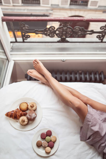 istock Woman having breakfast in bed in Paris 929051574