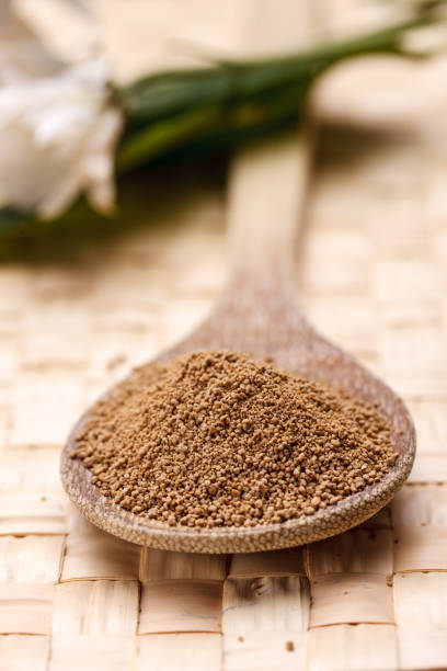 istock Wooden spoon full of pure sugar. 929052618
