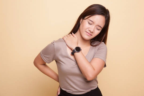 istock Young Asian woman got back pain. 929056232