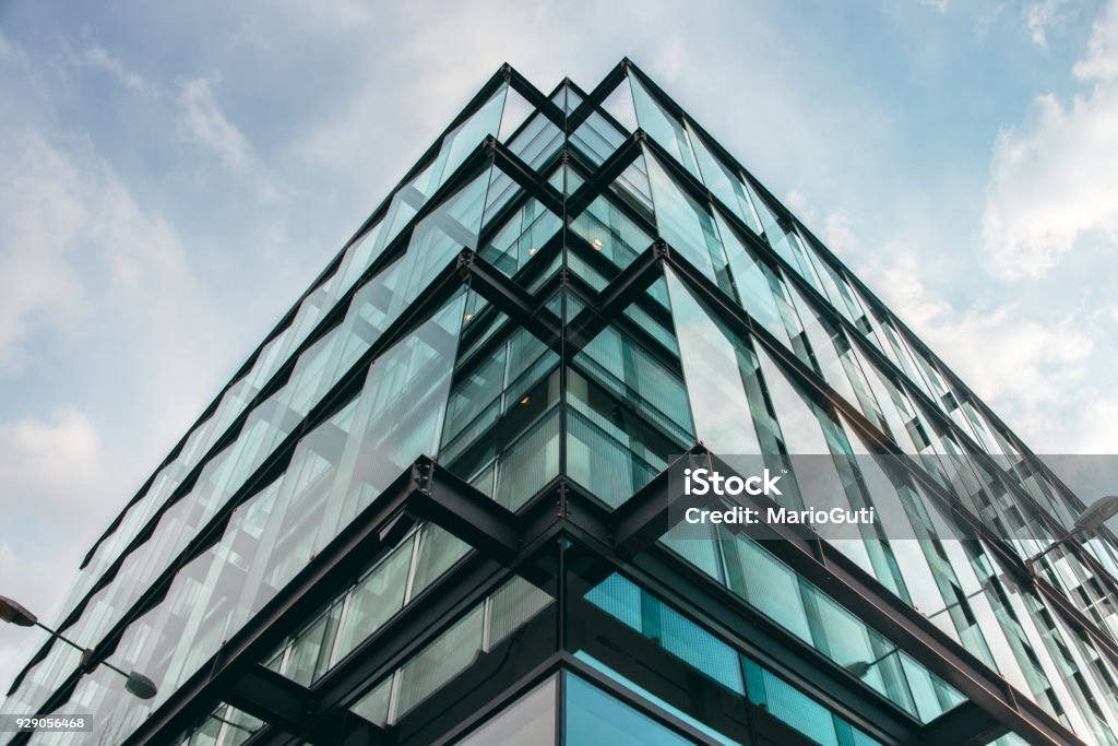 Modern office building facade A modern office building facade made of glass Architecture Stock Photo