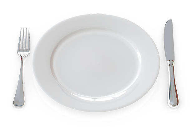istock Empty plate and cutlery isolated over a white background. 92905693
