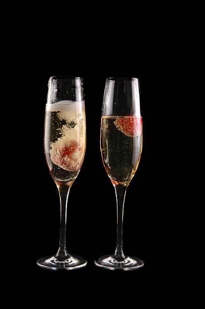 istock glass of champagne with strawberry 92905985