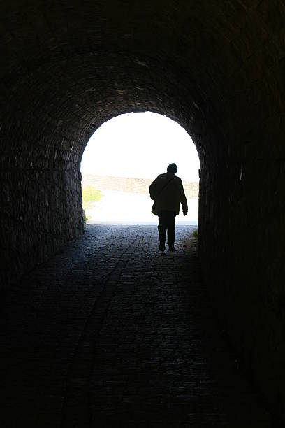 istock person in dark tunnel 92906143