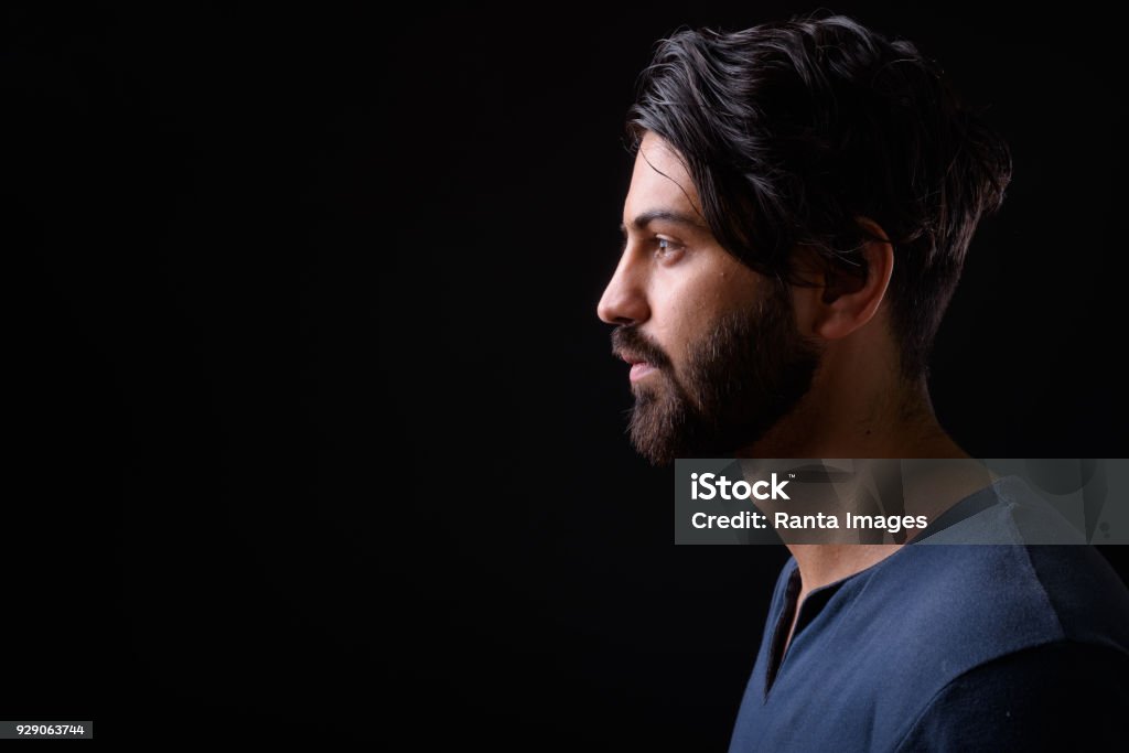 Portrait Of Handsome Man Against Black Background Studio Shot Of Handsome Man Against Black Background Profile View Stock Photo