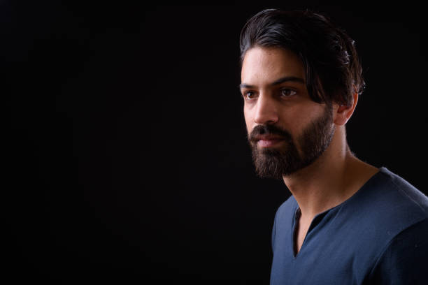 istock Portrait Of Handsome Man Against Black Background 929063802