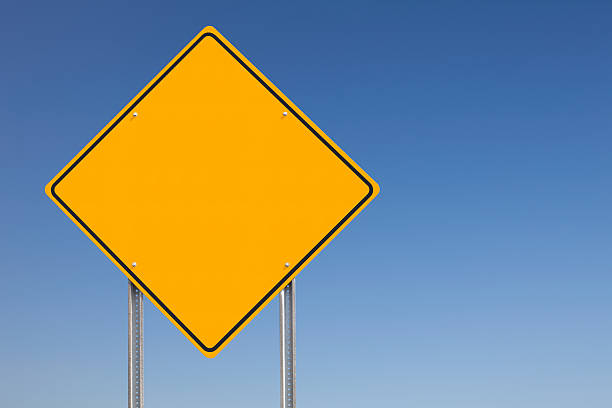 istock Yellow Diamond-shaped Blank Traffic Sign Post over Blue Sky 92906613