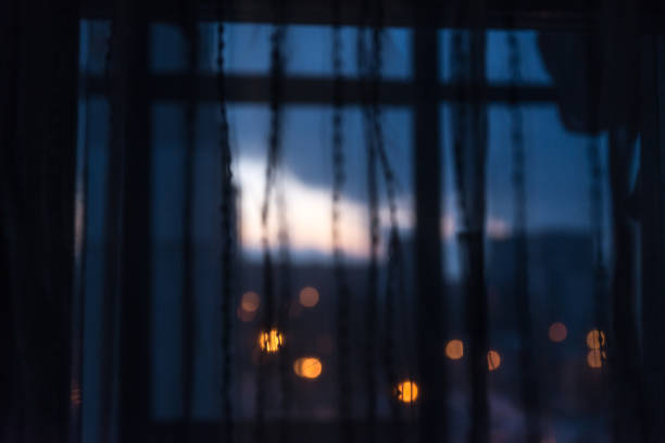 istock sunrise view through curtain of window. wake up time 929082002