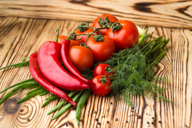 istock Composition with assorted raw organic vegetables such as tomatoes, sweet peppers, herbs and onions. Detox diet 929087772