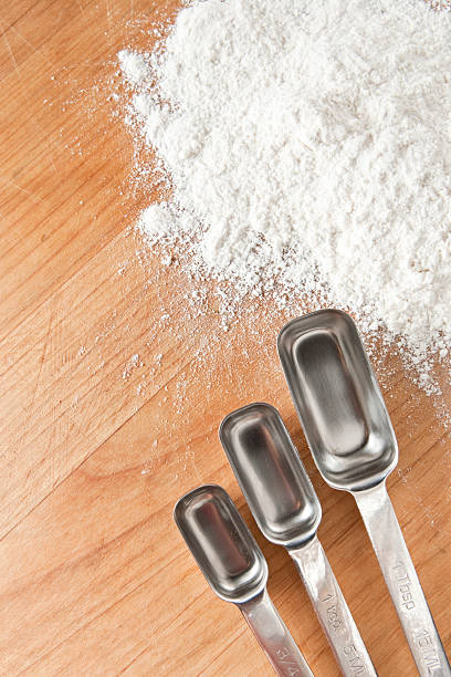 istock Measuring Spoons on Wood Surface with Flower 92909348