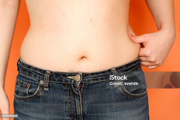 Girl And Her Problem Waist Stock Photo - Download Image Now - Women, Pot Belly - Human Body, Belly Button