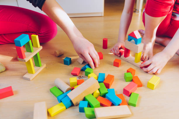 istock children playing with colorful wooden blocks 929102486